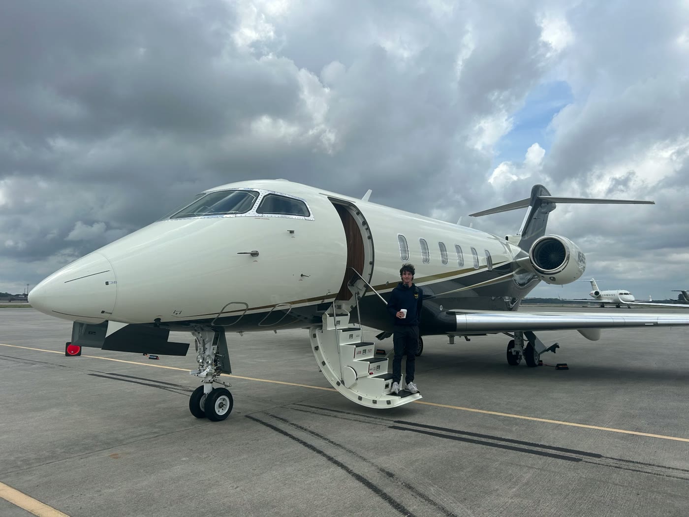 Alex, founder of FlightPath Design, on the ramp with a business jet