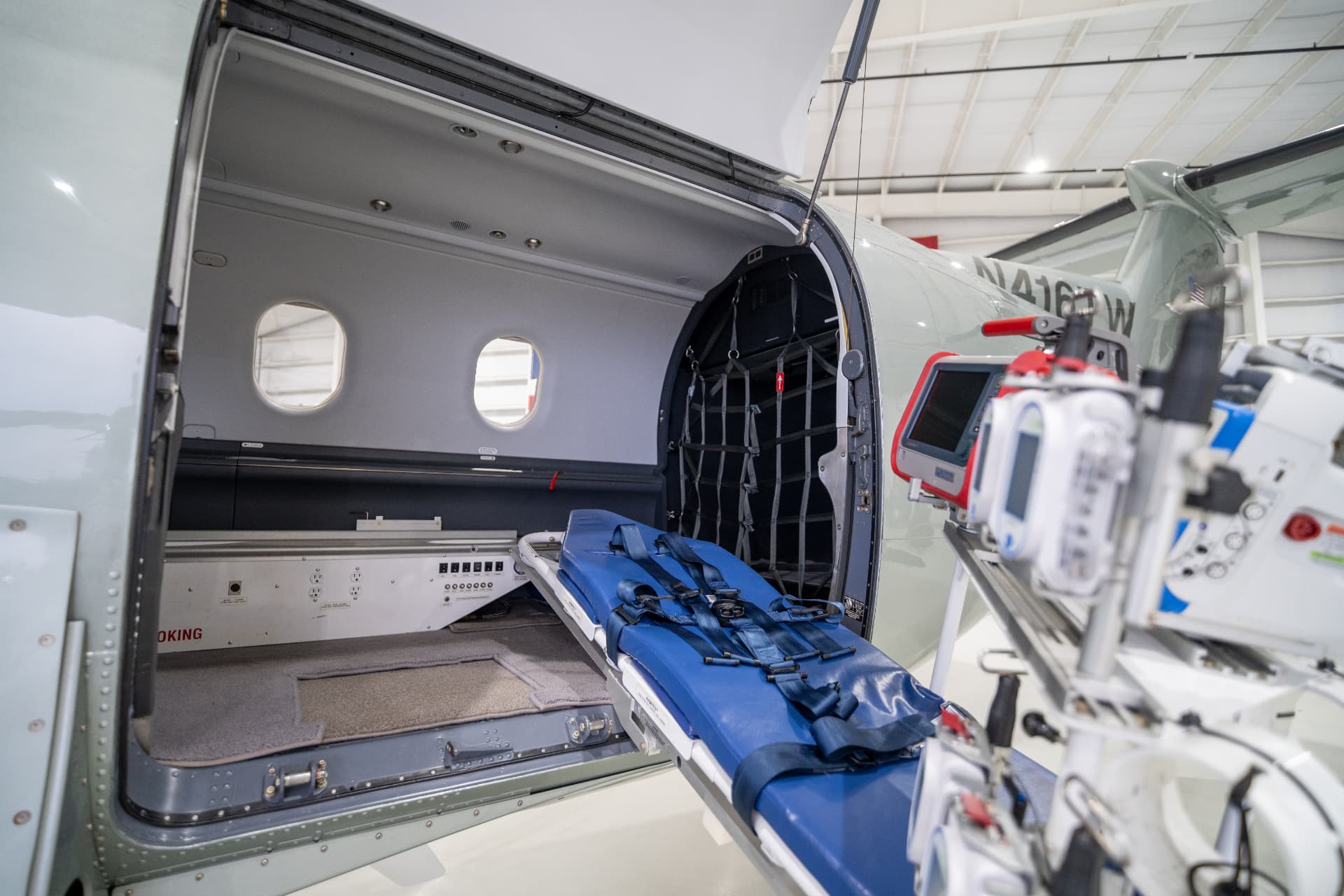 Air medical interior of a Pilatus PC-12 with stretcher and monitoring equipment loaded through the cargo door